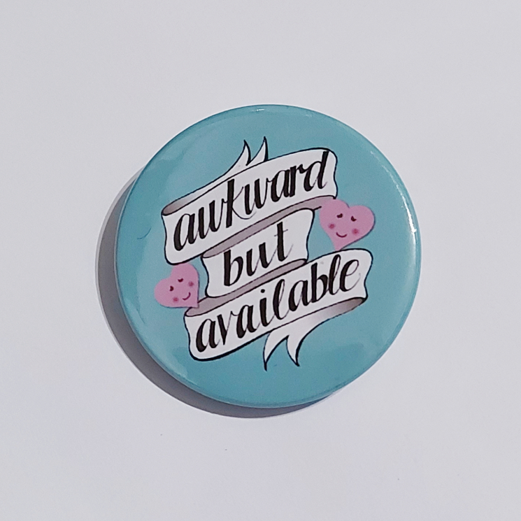 Badge with a teal background that reads "awkward but available"