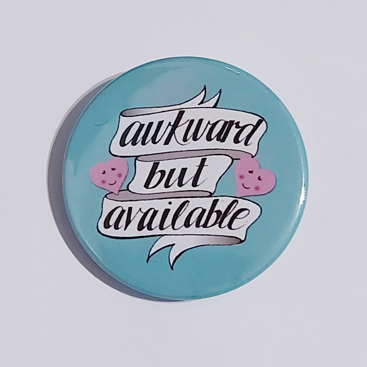 Badge with a teal background that reads "awkward but available"