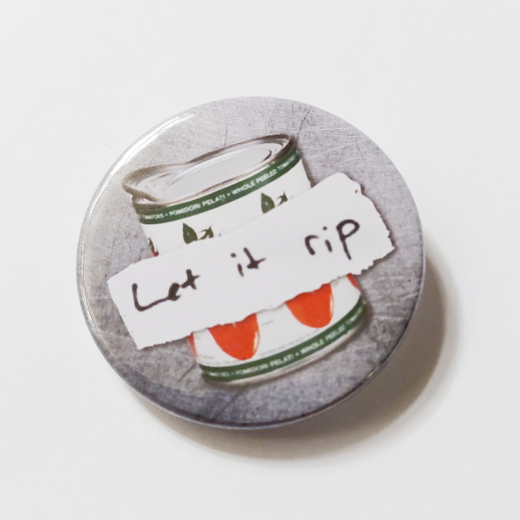 Round badge with silver background, can of tomatoes, "Let it Rip" banner