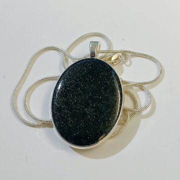 Medium Oval Silver pendant with deep blue glittery resin stone