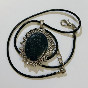 Small Oval Silver pendant with deep blue glittery resin stone